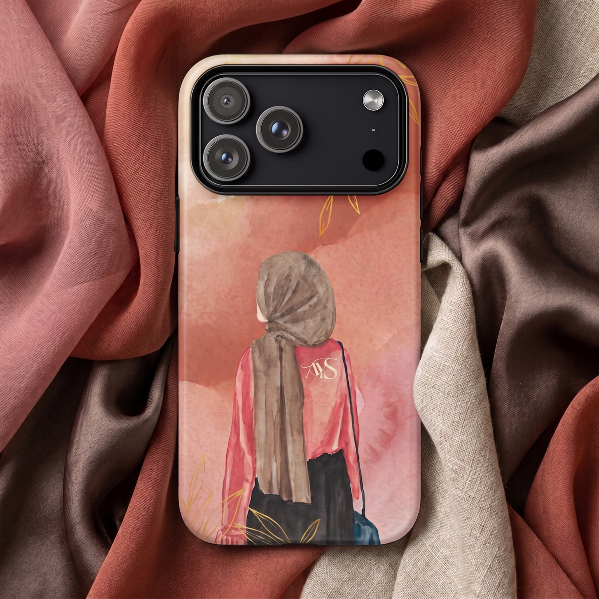 Blush Bloom hijabi tough phone case displayed on layered pink, cream and shimmering brown fabrics