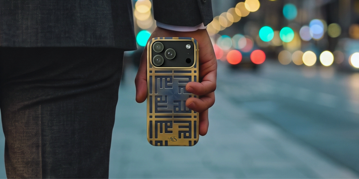 Person in a dark suit holding a Royal Sapphire Allah tough phone case with a blurred city street and colorful lights in the background